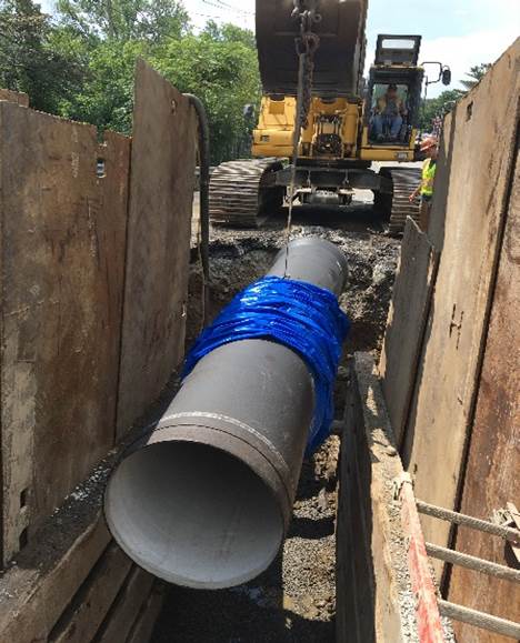 Installing pipe on Dedham Boulevard